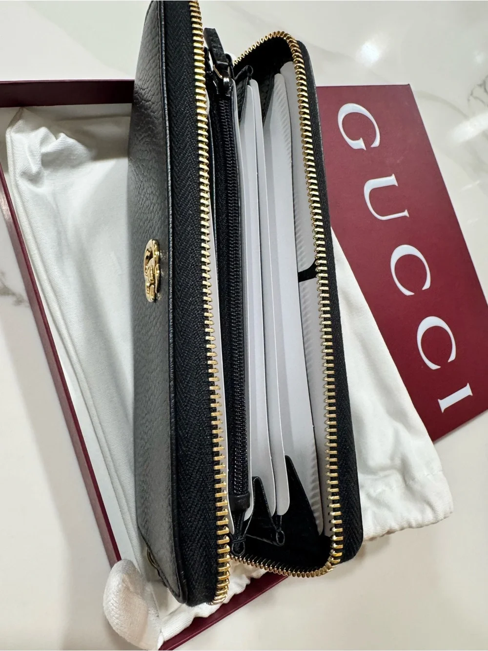 Gucci Black Pebbled Leather Zip Wallet with Gold Logo